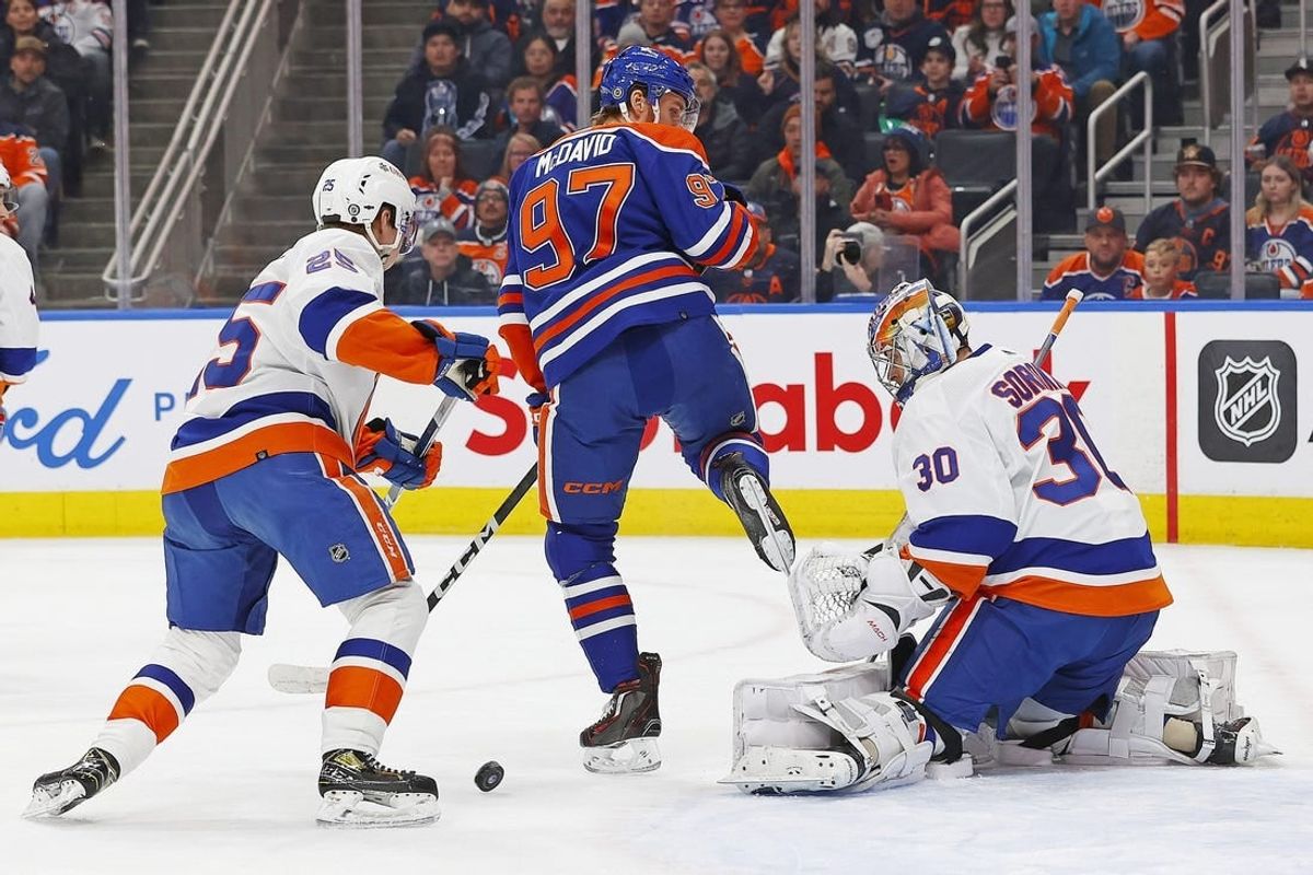 Nov 13, 2023; Edmonton, Alberta, CAN;  Edmonton Oilers forward Connor McDavid (97) tries to deflect a shot past New York Islanders goaltender Ilya Sorokin (30) during the first periodat Rogers Place.