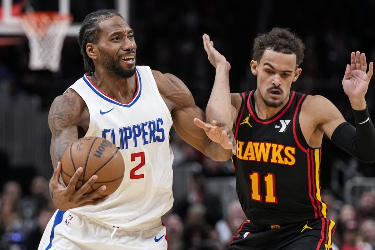 Feb 5, 2024; Atlanta, Georgia, USA; LA Clippers forward Kawhi Leonard (2) fights past Atlanta Hawks guard Trae Young (11) during the second half at State Farm Arena.