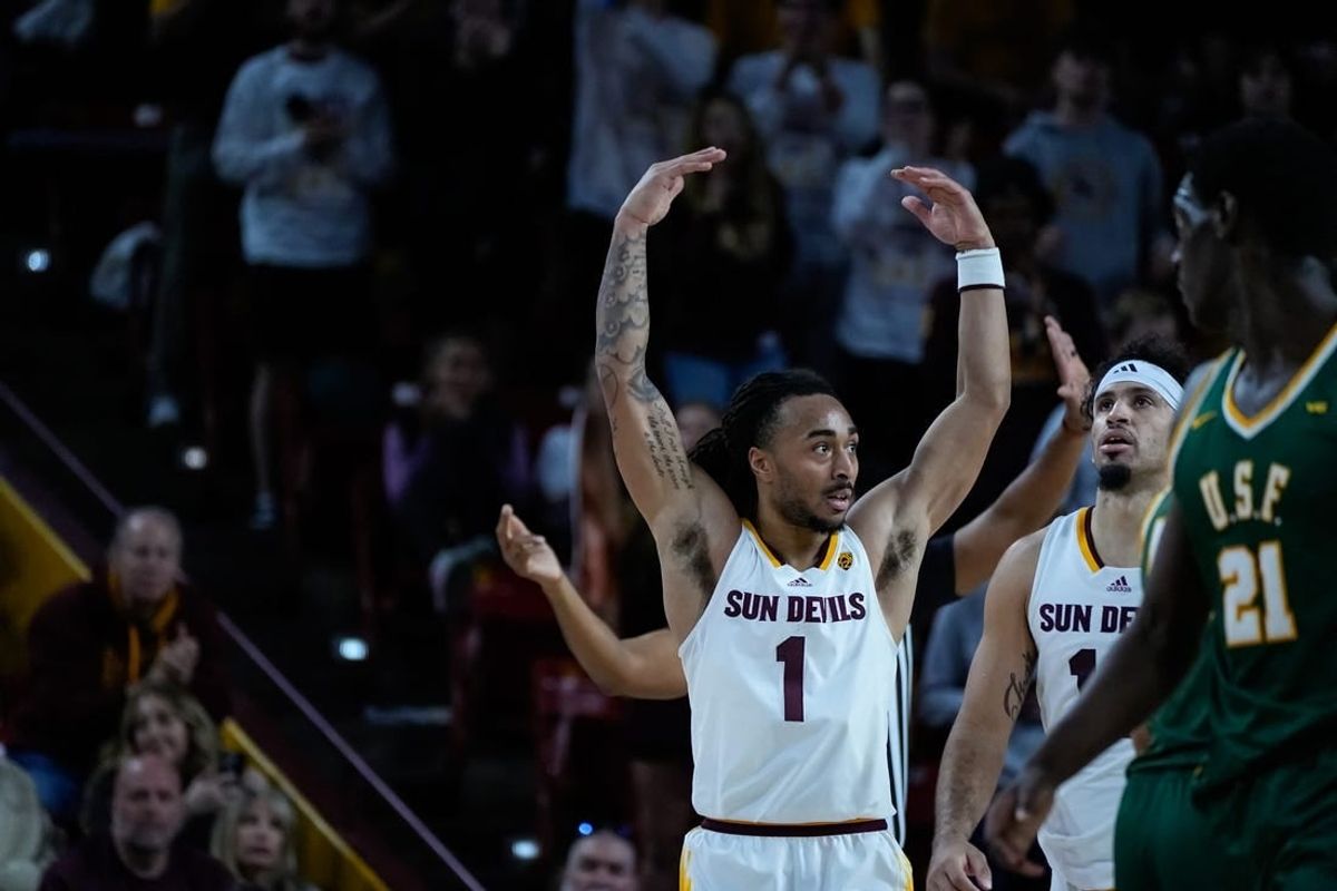Frankie Collins (1) of Arizona State University encourages the crowd to cheer during the second half of a game against the University of San Francisco at Desert Financial Arena on Dec. 3, 2023, in Tempe.