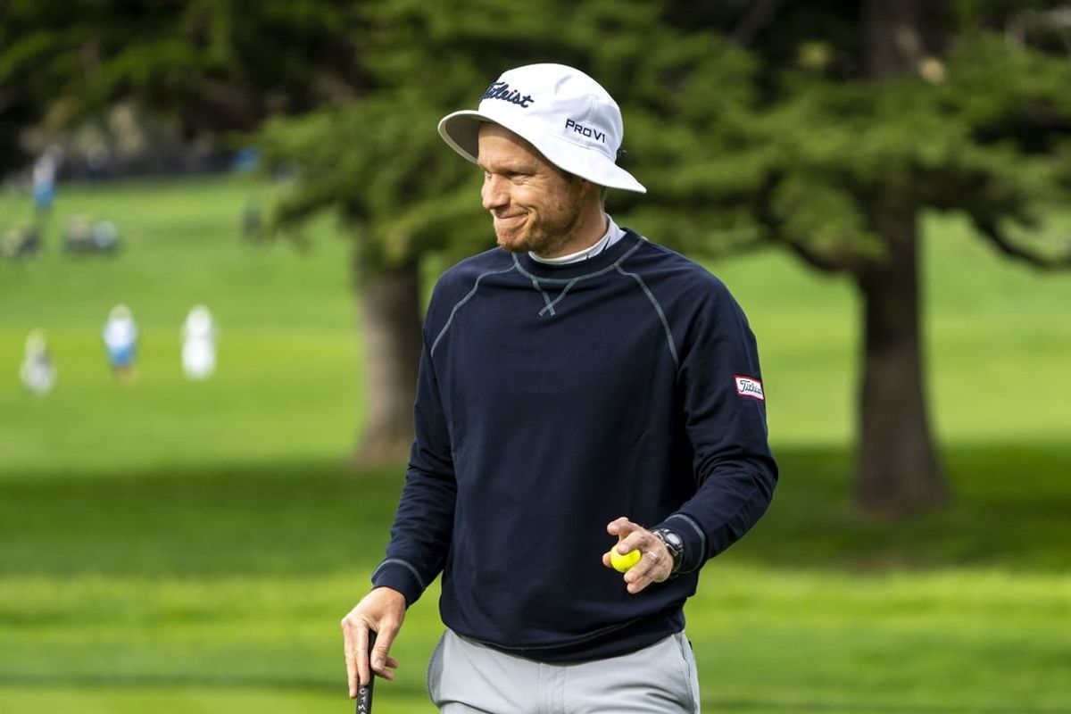 February 3, 2024; Pebble Beach, California, USA; Peter Malnati acknowledges the crowd after making his putt on the second hole during the third round of the AT&T Pebble Beach Pro-Am golf tournament at Pebble Beach Golf Links.
