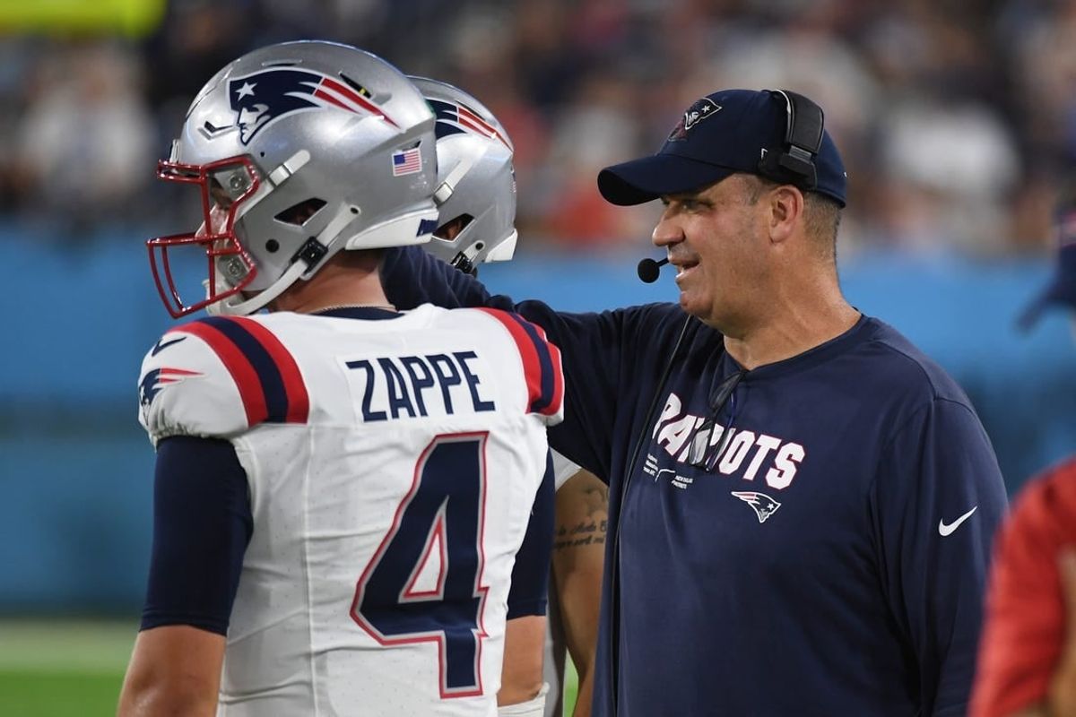 Aug 25, 2023; Nashville, Tennessee, USA; New England Patriots offensive coordinator Bill O'Brien talks with quarterback Bailey Zappe (4) during the first half against the Tennessee Titans at Nissan Stadium.