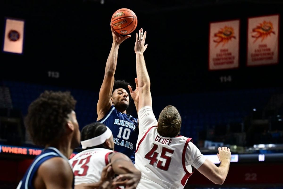 Nov 19, 2023; Uncasville, CT, USA; Washington State Cougars forward Oscar Cluff (45) jumps to block a shot by Rhode Island Rams forward Tyson Brown (10) during the first half at Mohegan Sun Arena.