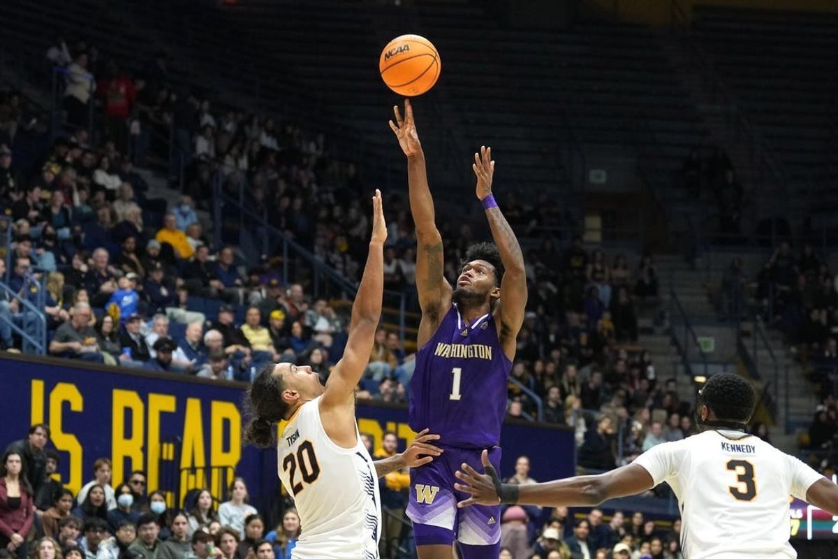 Jan 18, 2024; Berkeley, California, USA; Washington Huskies forward Keion Brooks Jr. (1) shoots against California Golden Bears guard Jaylon Tyson (20) during the first half at Haas Pavilion.