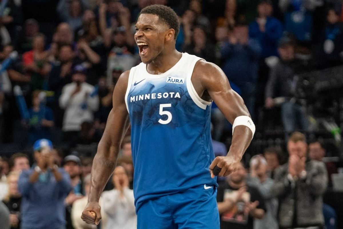 Apr 9, 2024; Minneapolis, Minnesota, USA; Minnesota Timberwolves guard Anthony Edwards (5) celebrates scoring a career high 51 points against the Washington Wizards in the fourth quarter at Target Center.