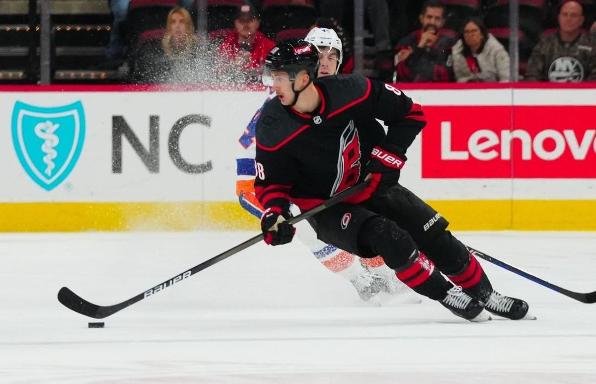 Nov 30, 2023; Raleigh, North Carolina, USA; Carolina Hurricanes center Martin Necas (88) skates against the New York Islanders during the overtime at PNC Arena.