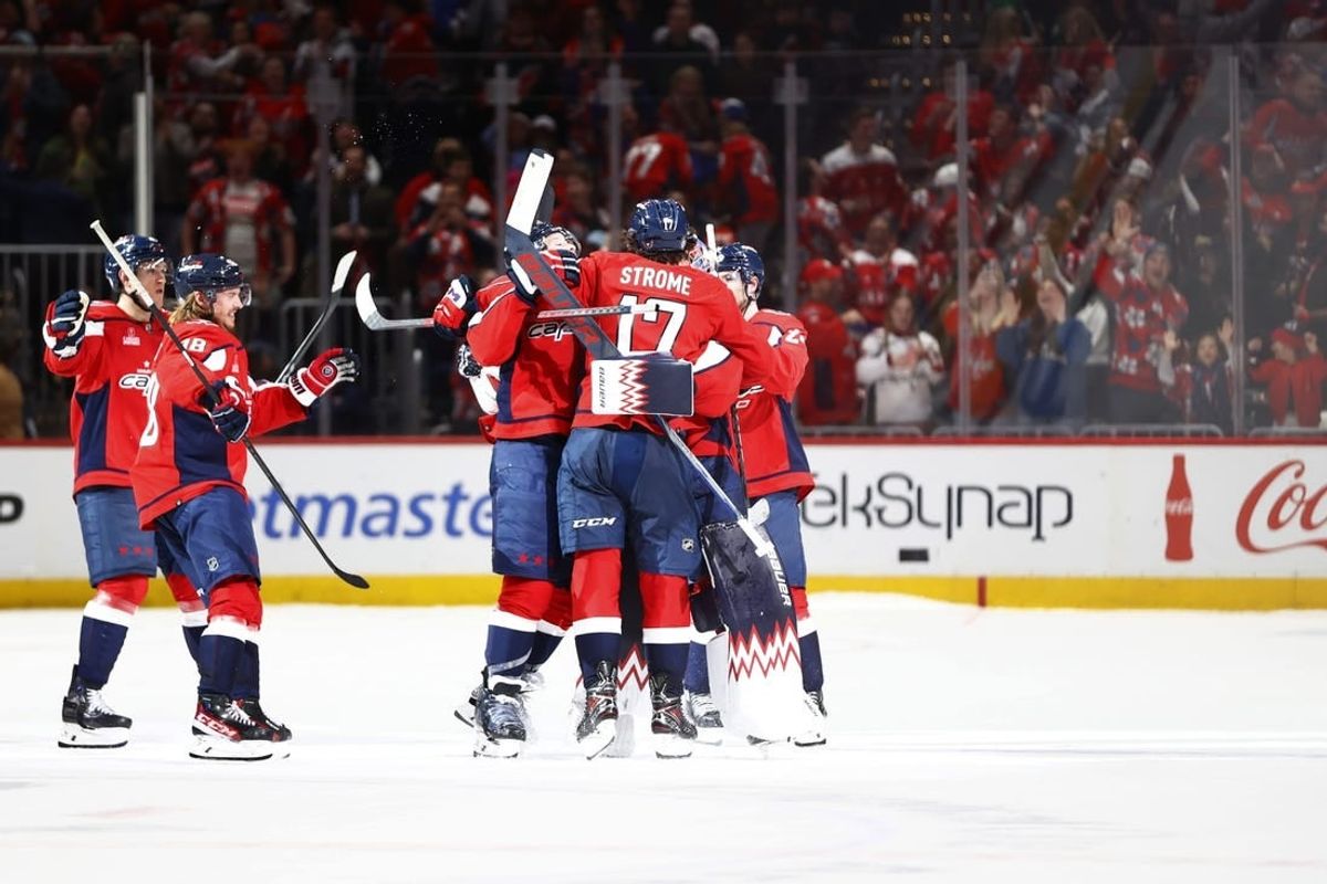 Mar 22, 2024; Washington, District of Columbia, USA; Washington Capitals players celebrate after defeating the Carolina Hurricanes during a shootout at Capital One Arena.
