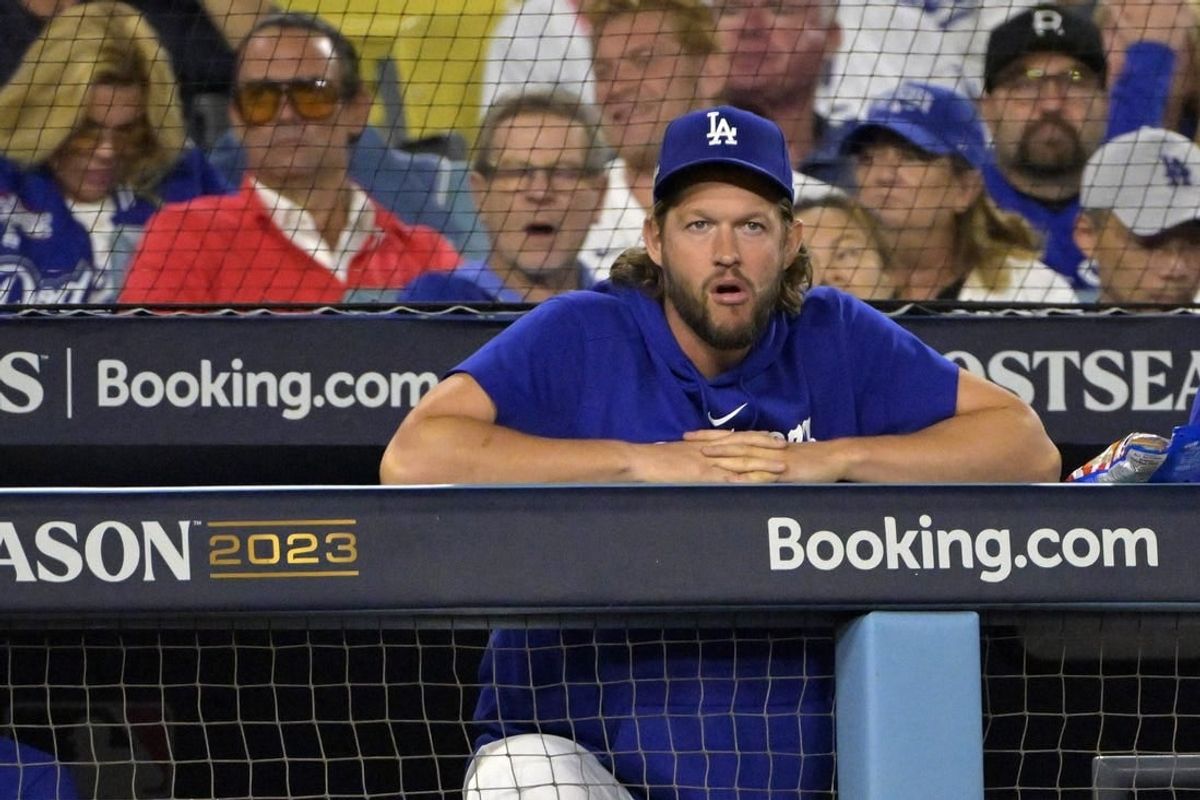 Oct 9, 2023; Los Angeles, California, USA; Los Angeles Dodgers starting pitcher Clayton Kershaw (22) looks on from the dug out against the Arizona Diamondbacks during the third inning for game two of the NLDS for the 2023 MLB playoffs at Dodger Stadium.