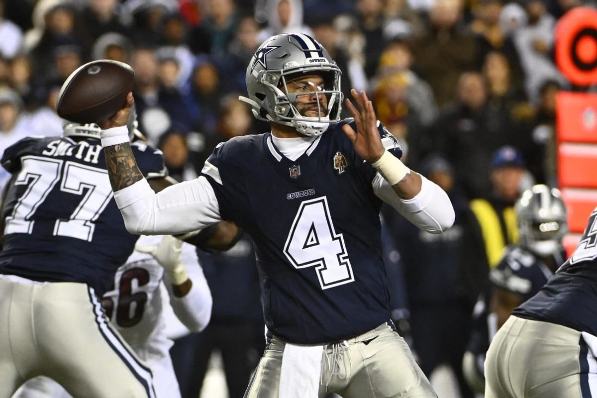 Jan 7, 2024; Landover, Maryland, USA; Dallas Cowboys quarterback Dak Prescott (4) attempts a pass against the Washington Commanders during the first half at FedExField.