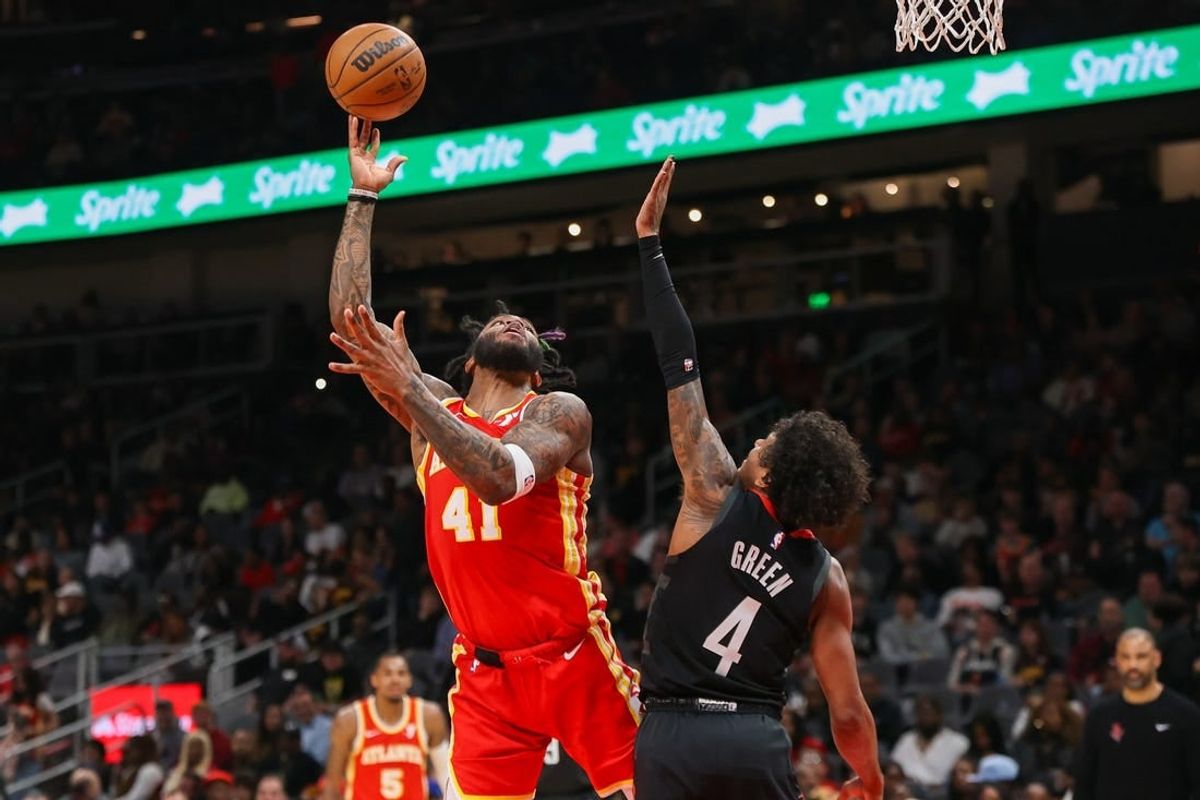 Feb 10, 2024; Atlanta, Georgia, USA; Atlanta Hawks forward Saddiq Bey (41) shoots past Houston Rockets guard Jalen Green (4) in the second quarter at State Farm Arena.