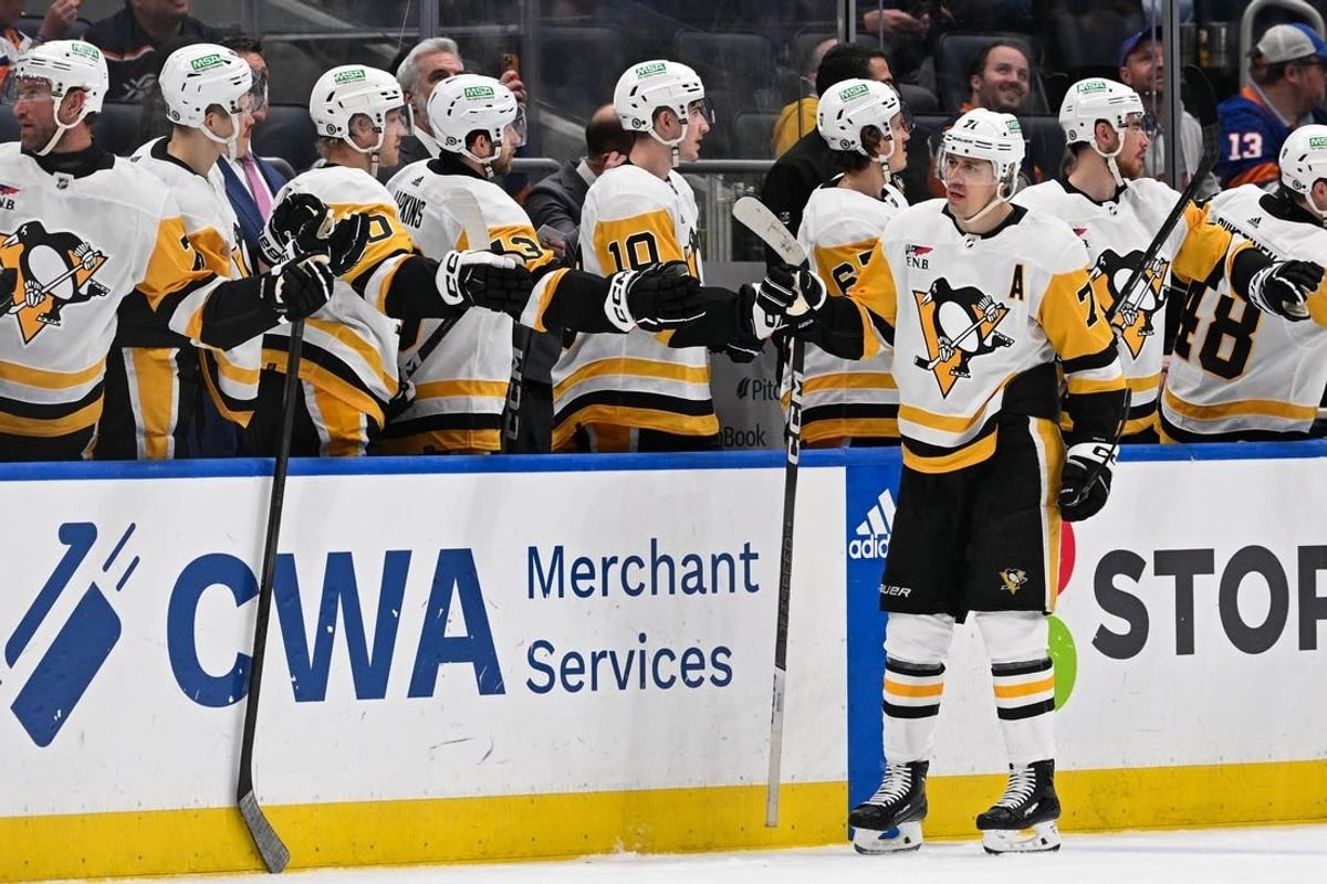 Apr 17, 2024; Elmont, New York, USA;  Pittsburgh Penguins center Jeff Carter (77) celebrates his goal against the New York Islanders during the second period at UBS Arena.