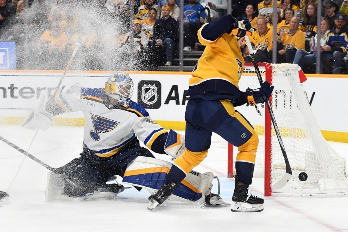 Apr 4, 2024; Nashville, Tennessee, USA; Nashville Predators left wing Jason Zucker (16) has a shot blocked by St. Louis Blues goaltender Jordan Binnington (50) during the first period at Bridgestone Arena.