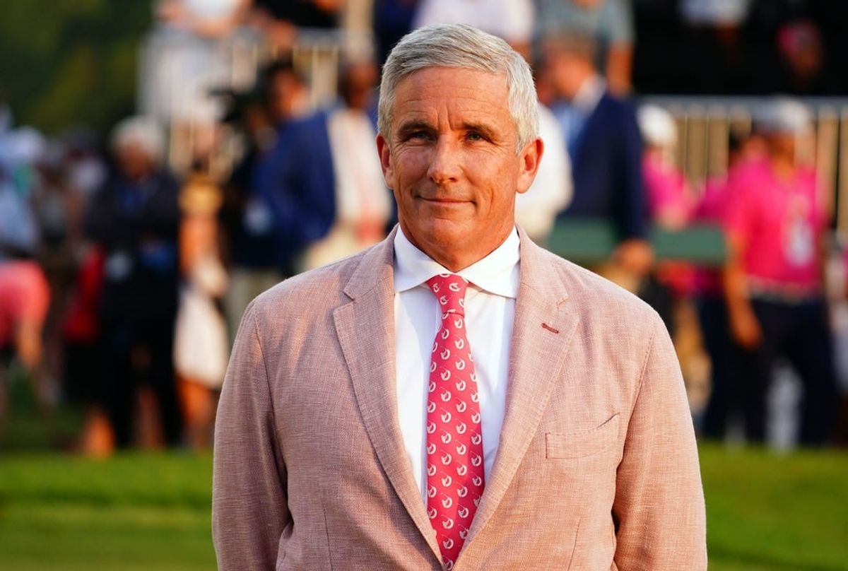 Aug 27, 2023; Atlanta, Georgia, USA; PGA TOUR commissioner Jay Monahan waits on the 18th green during the final round of the TOUR Championship golf tournament at East Lake Golf Club.