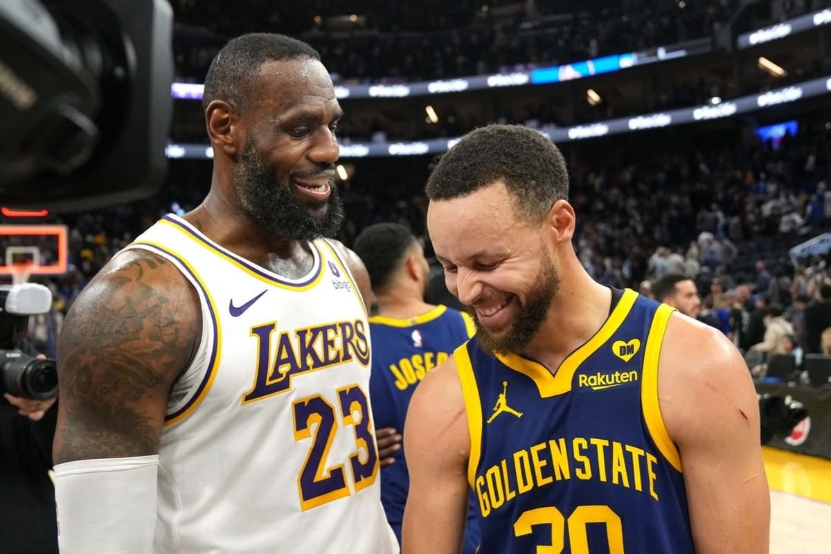 Jan 27, 2024; San Francisco, California, USA; Los Angeles Lakers forward LeBron James (23) and Golden State Warriors guard Stephen Curry (right) talk after the game at Chase Center.