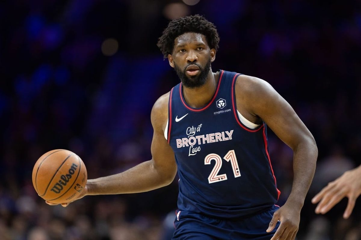 Dec 20, 2023; Philadelphia, Pennsylvania, USA; Philadelphia 76ers center Joel Embiid (21) dribbles up court against the Minnesota Timberwolves during the third quarter at Wells Fargo Center.