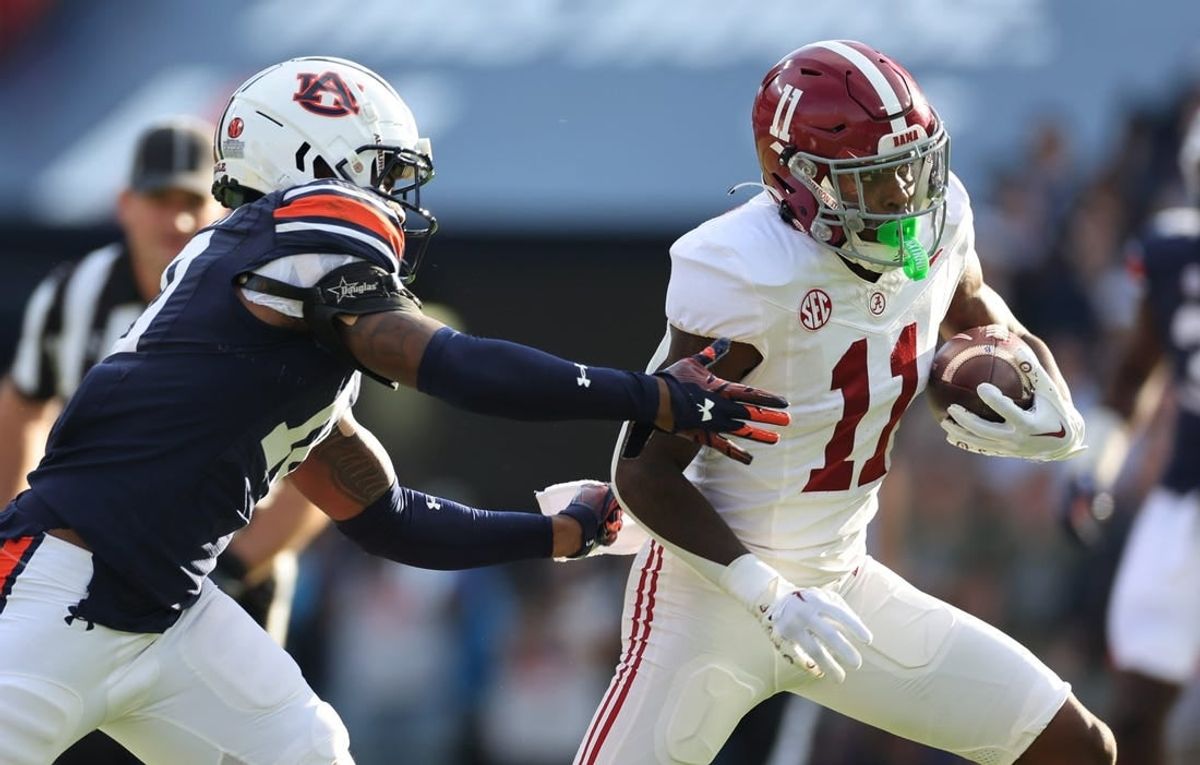 Nov 25, 2023; Auburn, Alabama, USA;  Auburn Tigers safety Zion Puckett (10) closes in on Alabama Crimson Tide wide receiver Malik Benson (11) during the first quarter at Jordan-Hare Stadium.