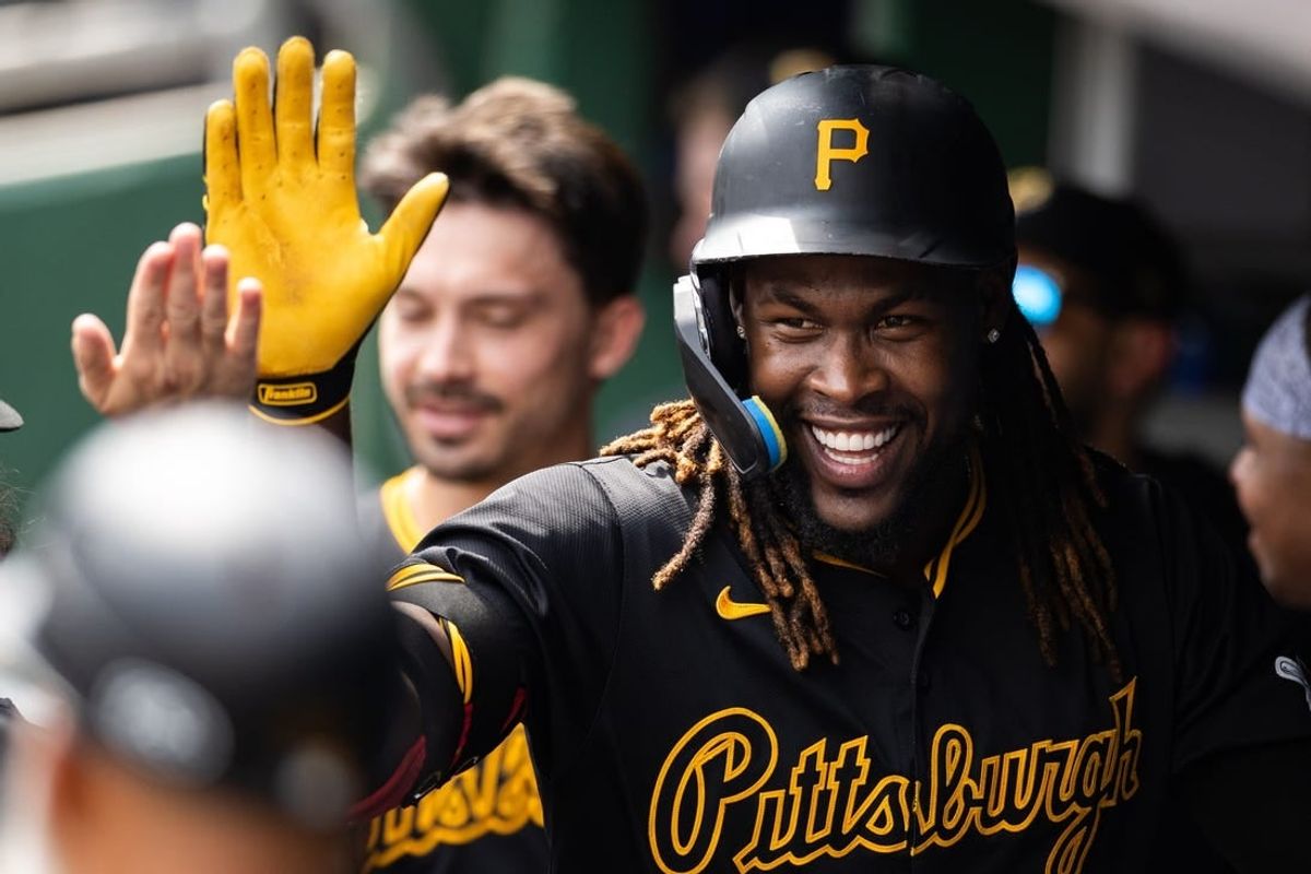 May 5, 2024; Pittsburgh, Pennsylvania, USA; Pittsburgh Pirates shortstop Oneil Cruz (15) gets high-fives from teammates following his home run during the sixth inning against the Colorado Rockies at PNC Park.