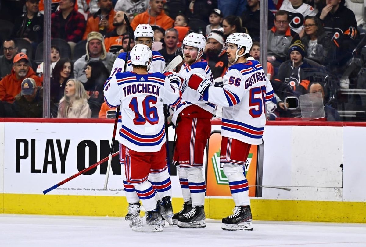 Feb 24, 2024; Philadelphia, Pennsylvania, USA; New York Rangers left wing Alexis Lafreniere (13) celebrates with teammates after scoring a goal against the Philadelphia Flyers in the second period at Wells Fargo Center.