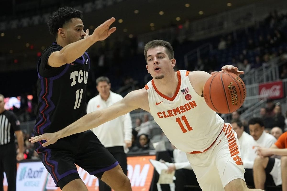 Dec 9, 2023; Toronto, Ontario, CAN; Clemson Tigers guard Joseph Girard III (11) drives against TCU Horned Frogs guard Trevian Tennyson (11) during the second half at Coca-Cola Coliseum.