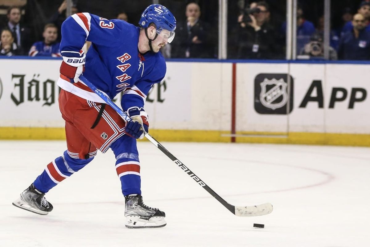 Nov 12, 2023; New York, New York, USA; New York Rangers left wing Alexis Lafreniere (13) scores the game winning goal in a shootout against the Columbus Blue Jackets at Madison Square Garden.
