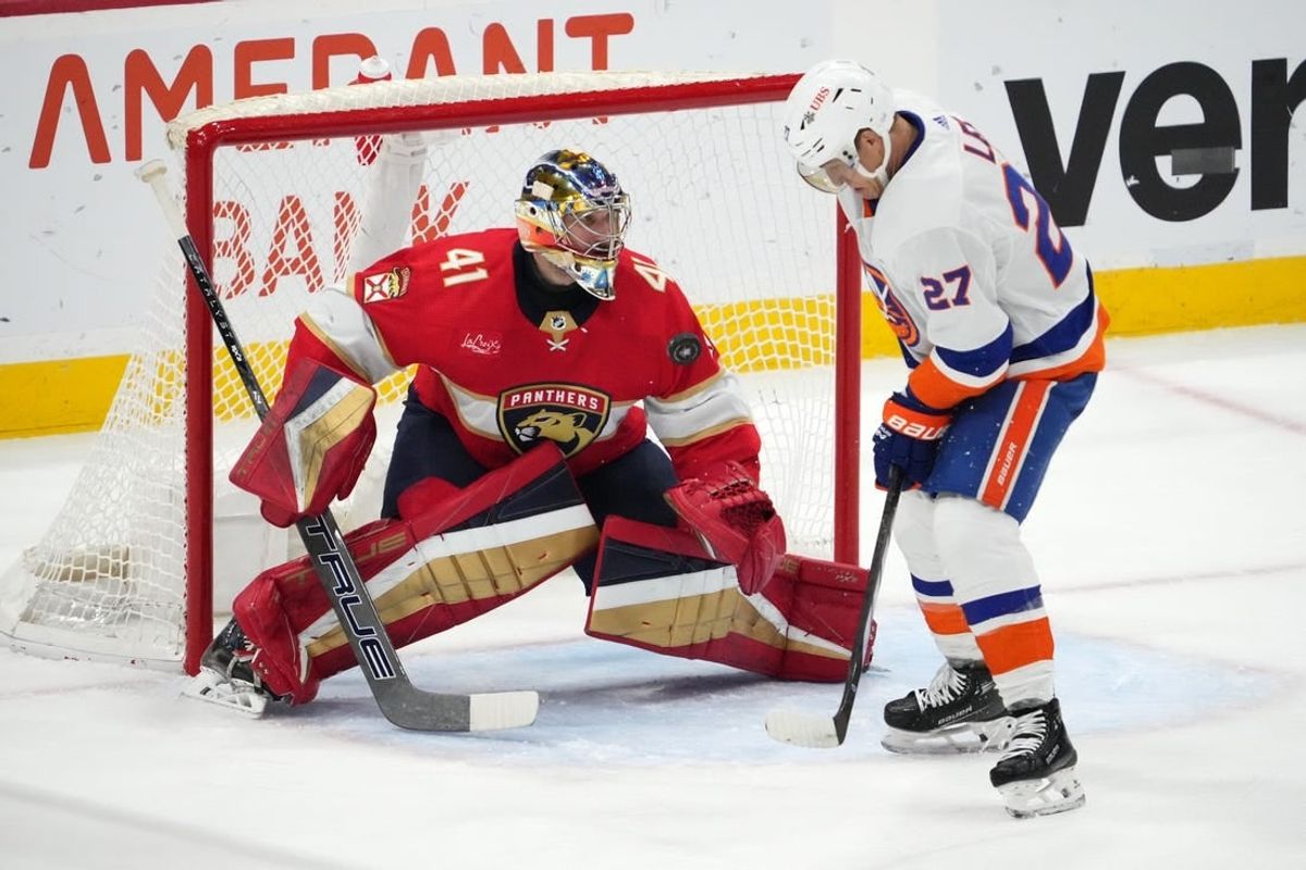 Dec 2, 2023; Sunrise, Florida, USA; Florida Panthers goaltender Anthony Stolarz (41) blocks the shot of New York Islanders left wing Anders Lee (27) during the second period at Amerant Bank Arena.