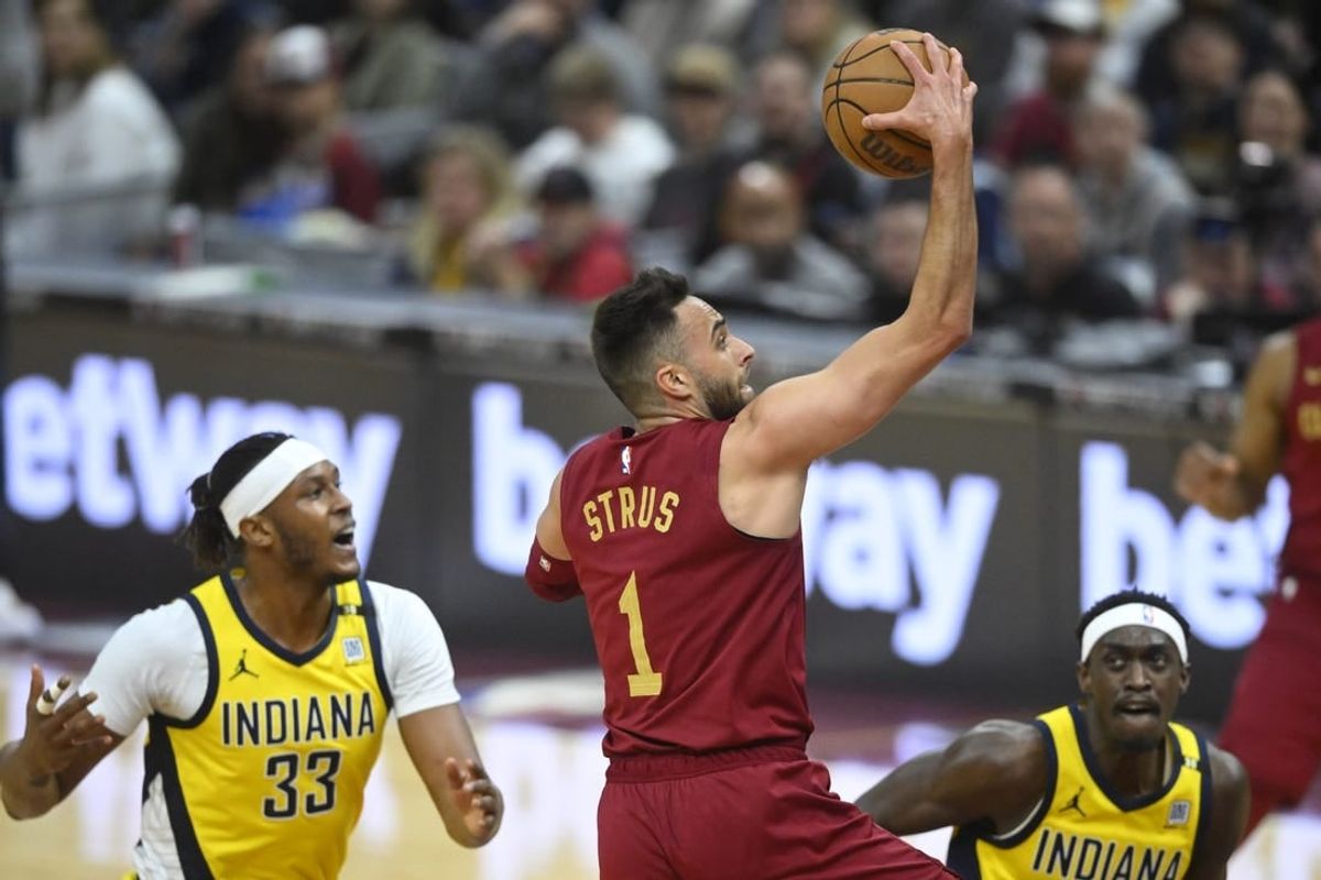 Apr 12, 2024; Cleveland, Ohio, USA; Cleveland Cavaliers guard Max Strus (1) drives to the basket between Indiana Pacers center Myles Turner (33) and forward Pascal Siakam (43) in the first quarter at Rocket Mortgage FieldHouse.