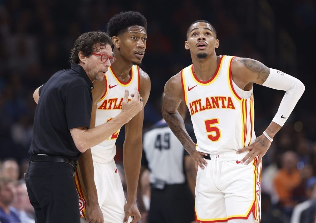 Nov 6, 2023; Oklahoma City, Oklahoma, USA; Atlanta Hawks head coach Quin Snyder talks with Atlanta Hawks forward De'Andre Hunter (12) and guard Dejounte Murray (5) during a break in play against the Oklahoma City Thunder in the second quarter at Paycom Center.