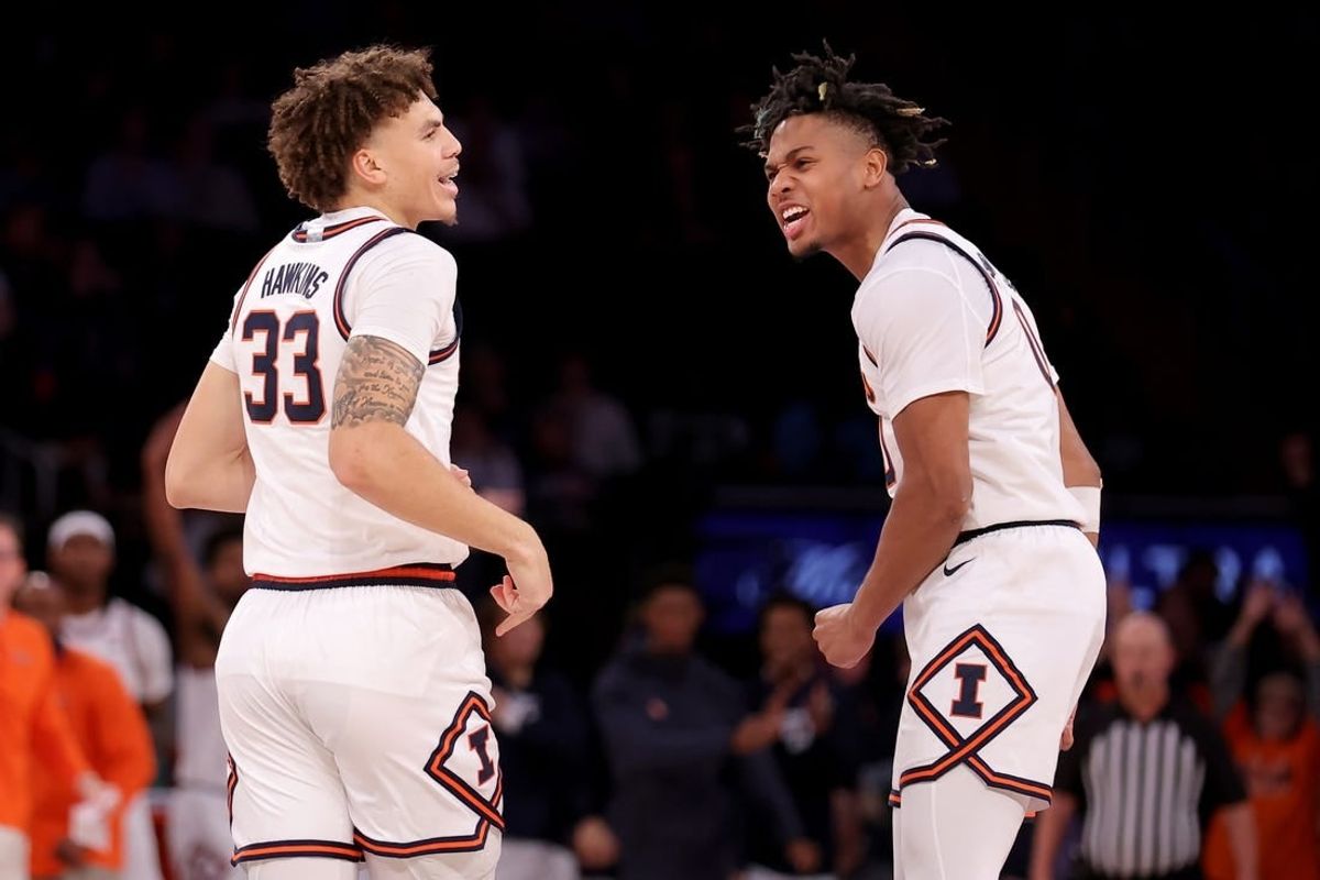 Illinois Fighting Illini forward Coleman Hawkins (33) celebrates his three point shot against the Florida Atlantic Owls with guard Terrence Shannon Jr. (0) during the second half at Madison Square Garden.