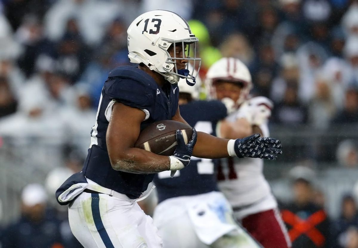 Oct 14, 2023; University Park, Pennsylvania, USA; Penn State Nittany Lions running back Kaytron Allen (13) runs with the ball during the second quarter against the Massachusetts Minutemen at Beaver Stadium. Penn State defeated Massachusetts 63-0.