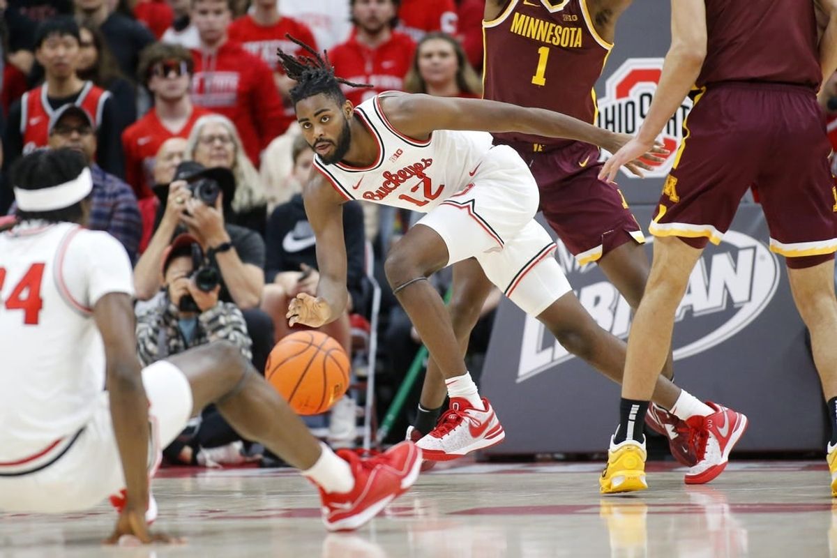Dec 3, 2023; Columbus, Ohio, USA;  Ohio State Buckeyes guard Evan Mahaffey (12) reaches for the loose ball during the first half against the Minnesota Golden Gophers at Value City Arena.