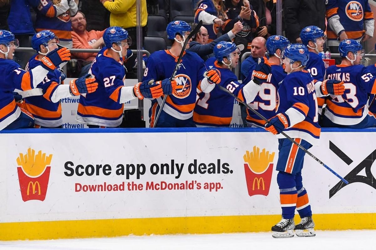 Dec 13, 2023; Elmont, New York, USA; New York Islanders right wing Simon Holmstrom (10) celebrates his short handed game winning goal against the Anaheim Ducks with the New York Islanders bench during the third period at UBS Arena.