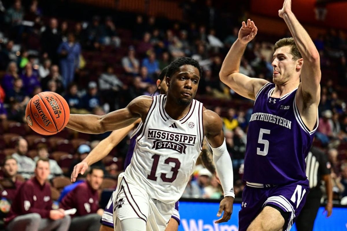 Nov 19, 2023; Uncasville, CT, USA;  Mississippi State Bulldogs guard Josh Hubbard (13) dribbles the ball challenged by Northwestern Wildcats guard Ryan Langborg (5) during the second halfat Mohegan Sun Arena.