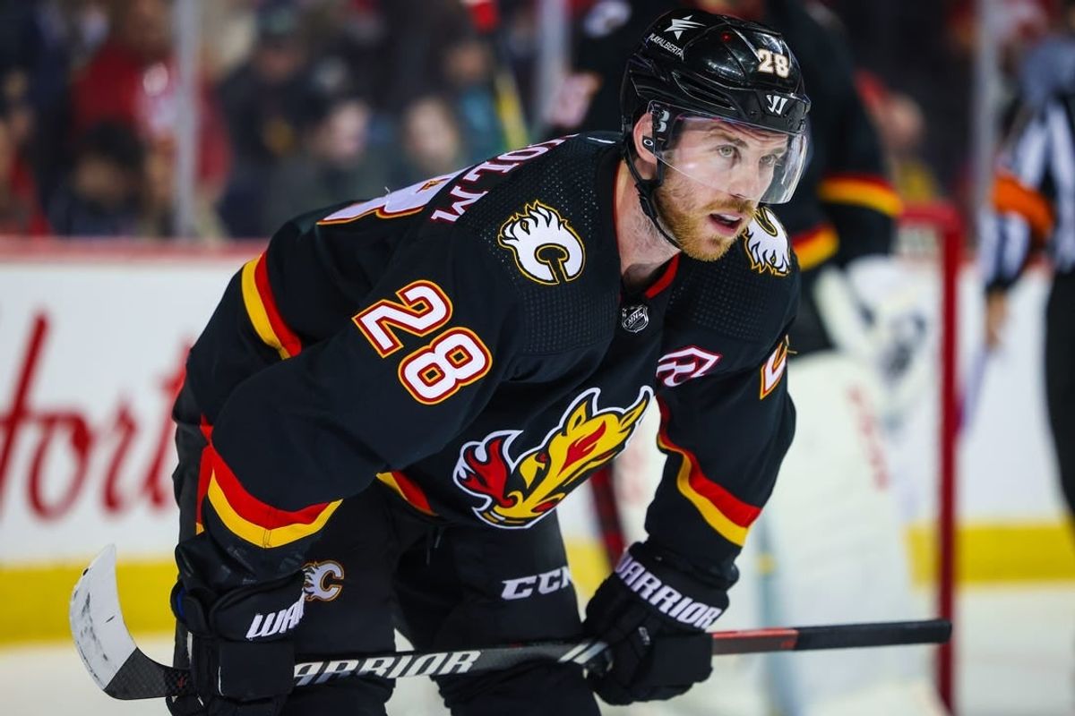 Jan 27, 2024; Calgary, Alberta, CAN; Calgary Flames center Elias Lindholm (28) during the face off against the Chicago Blackhawks during the third period at Scotiabank Saddledome.