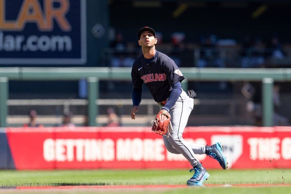 Apr 6, 2024; Minneapolis, Minnesota, USA; Cleveland Guardians shortstop Brayan Rocchio (4) tracks a fly ball from Minnesota Twins first base Alex Kirilloff (19) that would go foul in the first inning at Target Field.