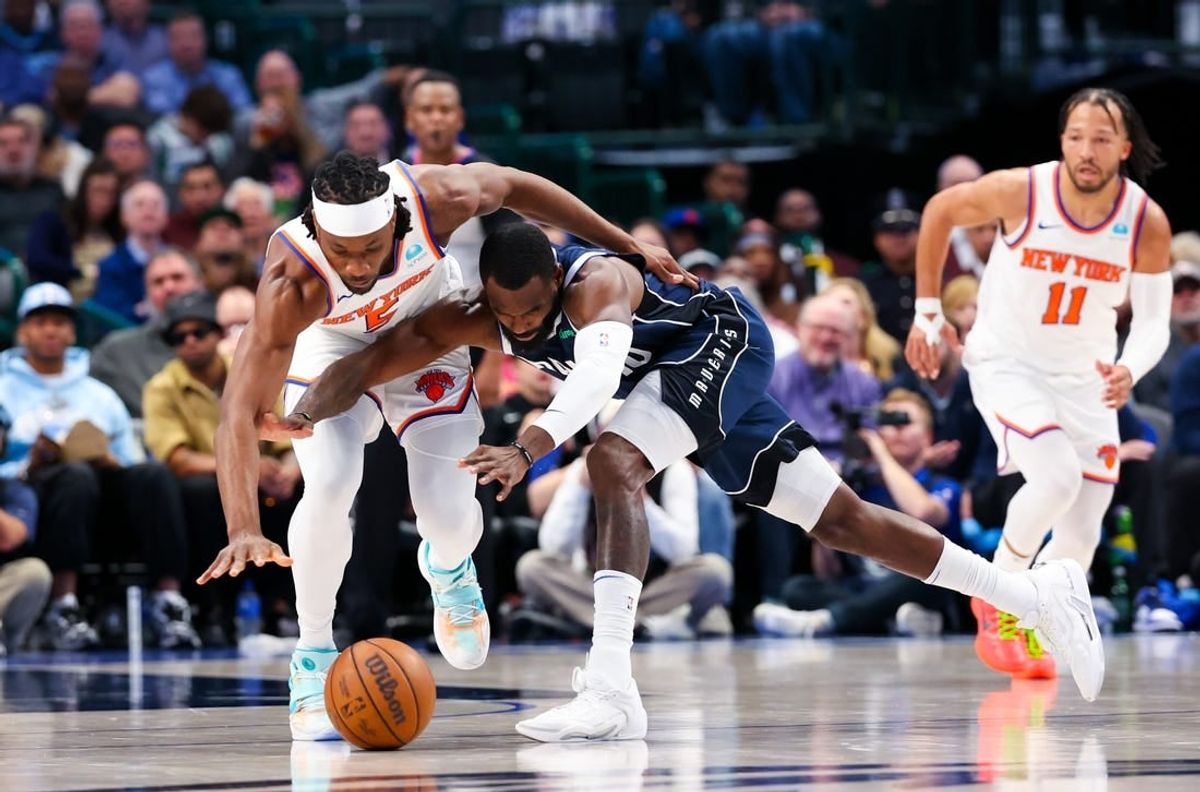 Jan 11, 2024; Dallas, Texas, USA; New York Knicks forward Precious Achiuwa (5) and Dallas Mavericks forward Tim Hardaway Jr. (10) go for a loose ball during the first half at American Airlines Center.