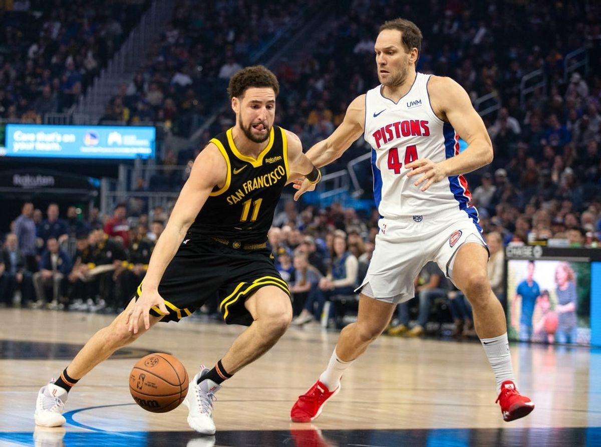 Jan 5, 2024; San Francisco, California, USA; Golden State Warriors guard Klay Thompson (11) drives past Detroit Pistons forward Bojan Bogdanovic (44) during the first quarter at Chase Center.