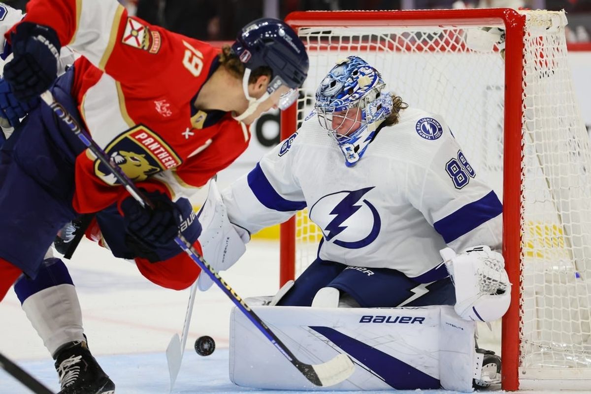 Apr 21, 2024; Sunrise, Florida, USA; Tampa Bay Lightning goaltender Andrei Vasilevskiy (88) makes a save against Florida Panthers left wing Matthew Tkachuk (19) during the first period in game one of the first round of the 2024 Stanley Cup Playoffs at Amerant Bank Arena.