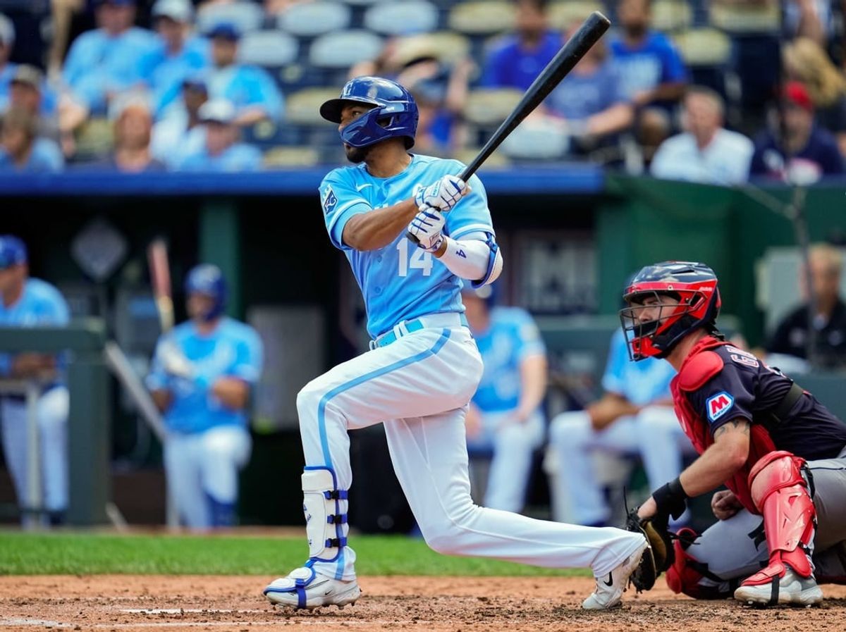 Sep 20, 2023; Kansas City, Missouri, USA; Kansas City Royals left fielder Edward Olivares (14) bats during the third inning against the Cleveland Guardians at Kauffman Stadium.