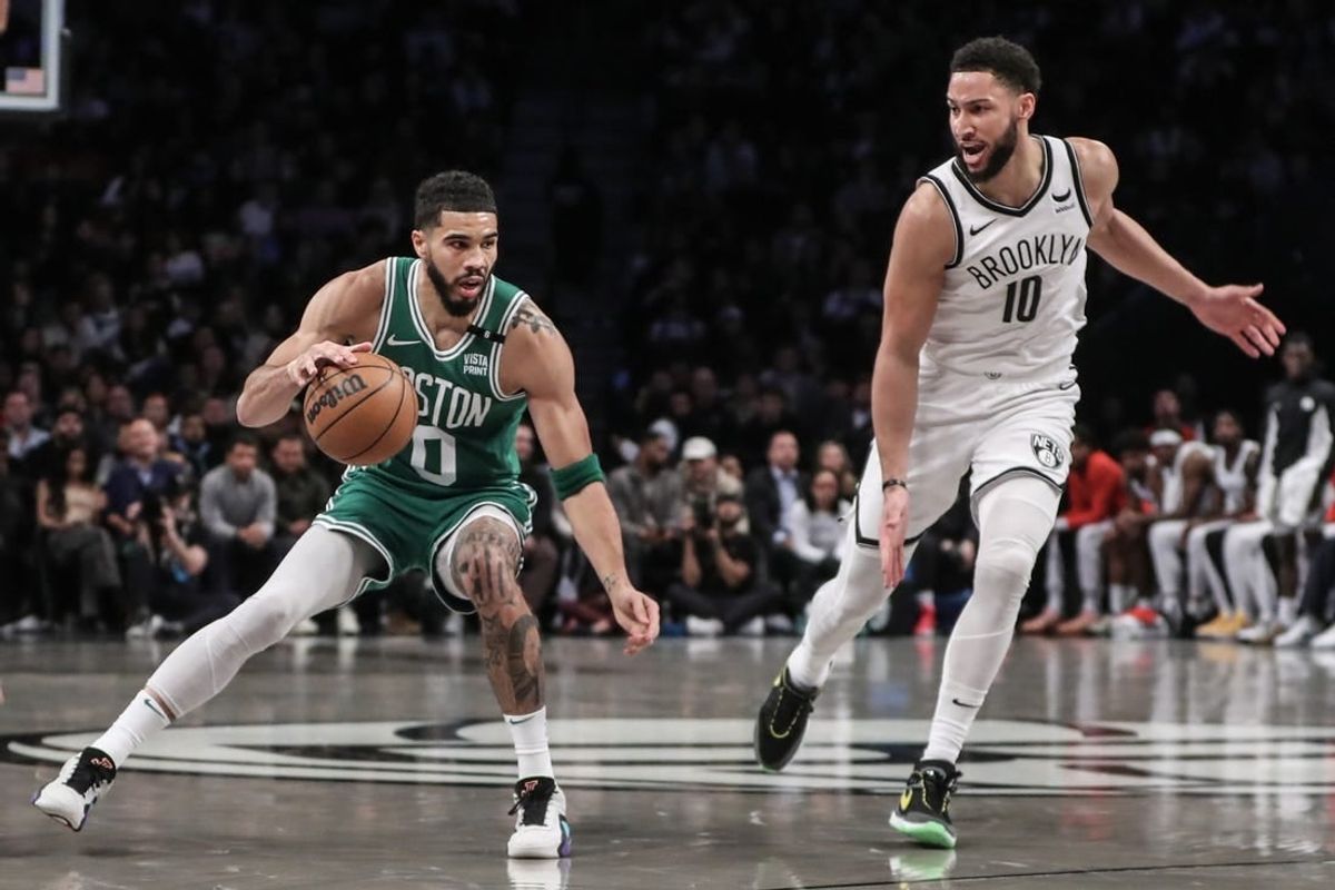 Feb 13, 2024; Brooklyn, New York, USA;  Boston Celtics forward Jayson Tatum (0) looks to drive past Brooklyn Nets guard Ben Simmons (10) in the second quarter at Barclays Center.