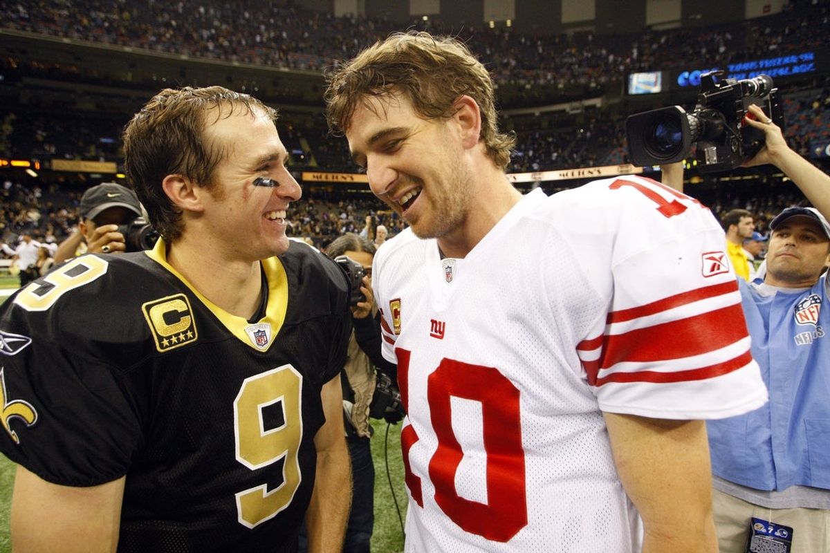 November 28, 2011; New Orleans, LA, USA;  New Orleans Saints quarterback Drew Brees (9) greets New York Giants quarterback Eli Manning (10) midfield following the Saints 49-24 victory at the Mercedes-Benz Superdome. Mandatory Credit: John David Mercer-Imagn Images