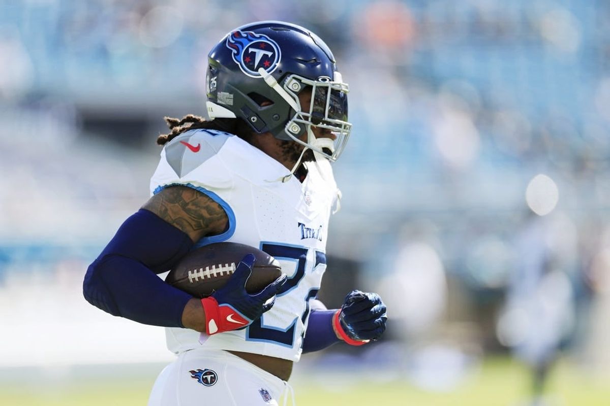 Tennessee Titans running back Derrick Henry (22) runs the ball before an NFL football matchup Sunday, Nov. 19, 2023 at EverBank Stadium in Jacksonville, Fla. [Corey Perrine/Florida Times-Union]