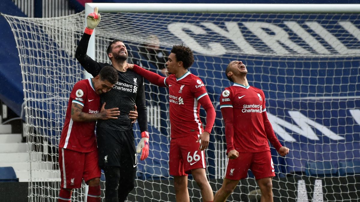 Liverpool’s   goalkeeper,  Alisson  Becker,   celebrates  scoring  his  team’s  second  goal  with  teammates  during  the  English  Premier  League  football  match  between  West  Bromwich  Albion  and  Liverpool.