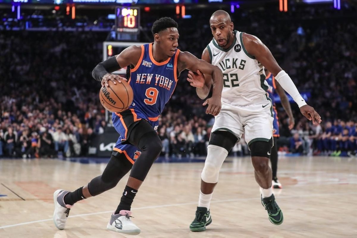 Dec 23, 2023; New York, New York, USA;  New York Knicks guard RJ Barrett (9) drives past Milwaukee Bucks forward Khris Middleton (22) in the first quarter at Madison Square Garden.
