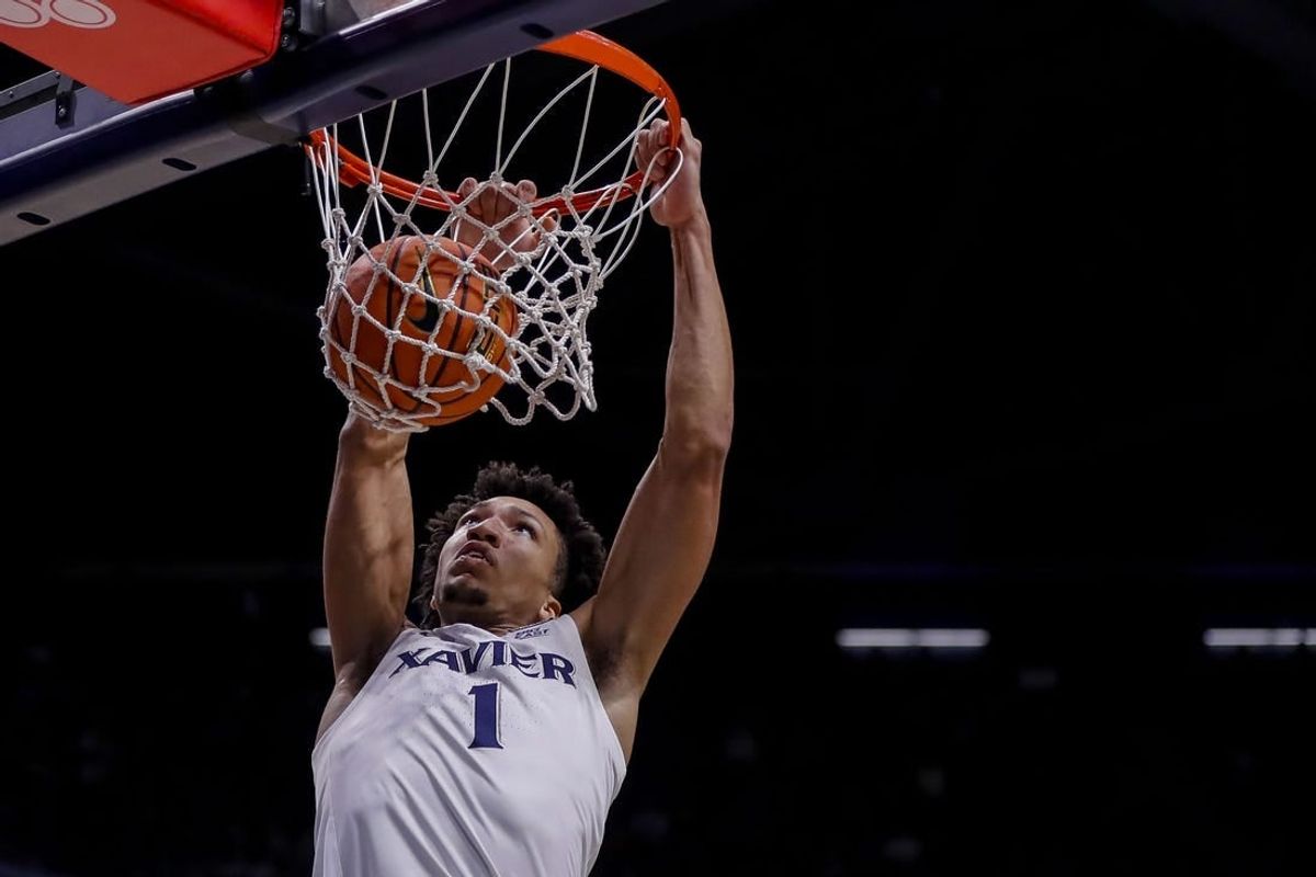 Nov 6, 2023; Cincinnati, Ohio, USA; Xavier Musketeers guard Desmond Claude (1) dunks on the Robert Morris Colonials in the first half at Cintas Center.