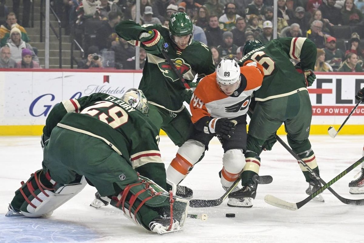 Jan 12, 2024; Saint Paul, Minnesota, USA; Philadelphia Flyers forward Cam Atkinson (89) hunts for a rebound as Minnesota Wild defenseman Jon Merrill (4) and defenseman Dakota Mermis (6) defend in front of goalie Marc-Andre Fleury (29) during the first period at Xcel Energy Center.