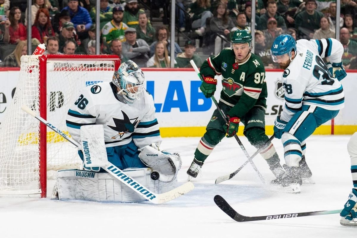 Mar 3, 2024; Saint Paul, Minnesota, USA; San Jose Sharks goaltender Kaapo Kahkonen (36) makes a save as Minnesota Wild left wing Kirill Kaprizov (97) awaits a rebound in the second period at Xcel Energy Center.