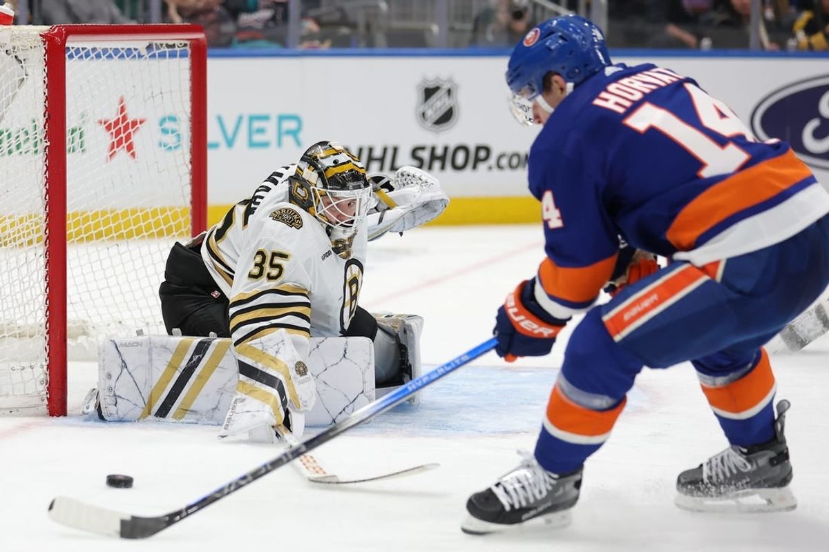 Mar 2, 2024; Elmont, New York, USA; Boston Bruins goaltender Linus Ullmark (35) makes a save against New York Islanders center Bo Horvat (14) during the second period at UBS Arena.