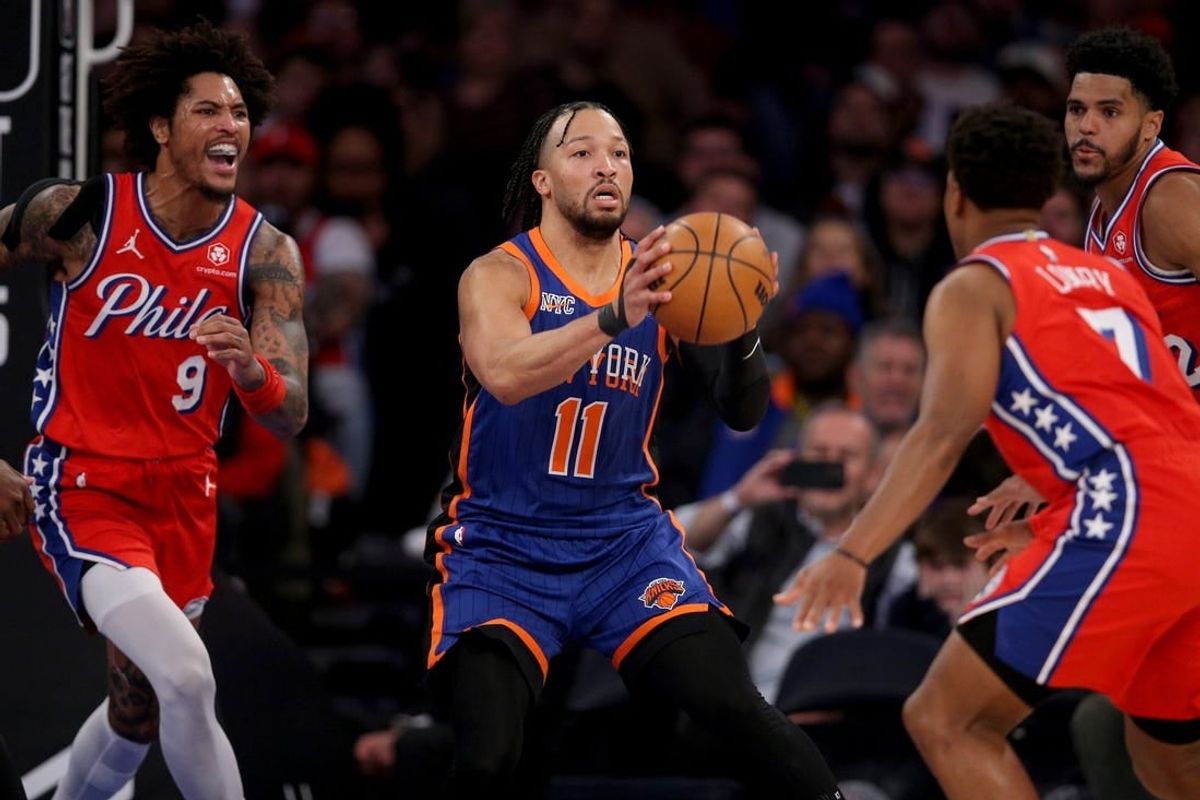 Mar 10, 2024; New York, New York, USA; New York Knicks guard Jalen Brunson (11) looks to pass the ball against Philadelphia 76ers guard Kelly Oubre Jr. (9) and forward Tobias Harris (12) and guard Kyle Lowry (7) during the second quarter at Madison Square Garden.