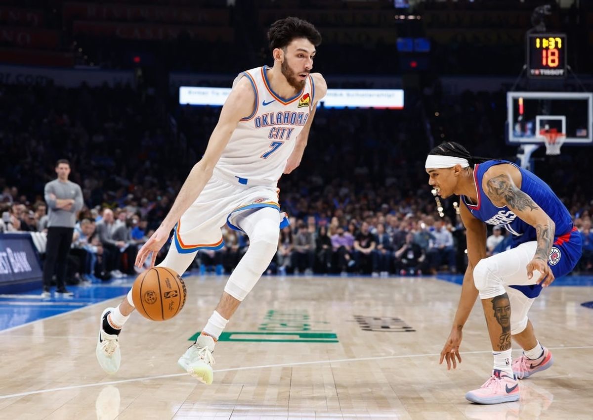 Dec 21, 2023; Oklahoma City, Oklahoma, USA; Oklahoma City Thunder forward Chet Holmgren (7) drives to the basket against LA Clippers guard Brandon Boston Jr. (4) during the second quarter at Paycom Center.