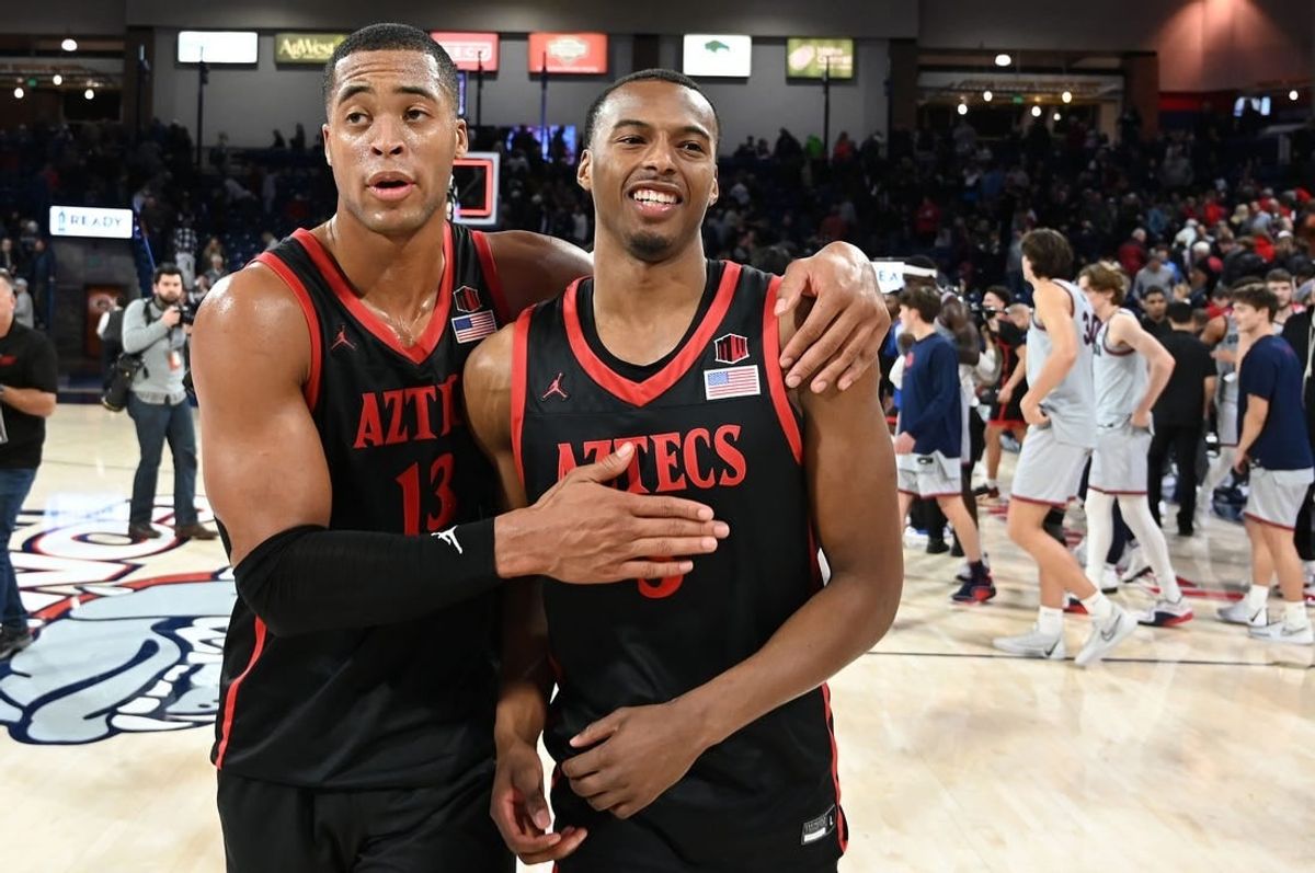 Dec 29, 2023; Spokane, Washington, USA; San Diego State Aztecs forward Jaedon LeDee (13) and guard Micah Parrish (3) celebrate after a game against the Gonzaga Bulldogs at McCarthey Athletic Center. San Diego won 84-74.