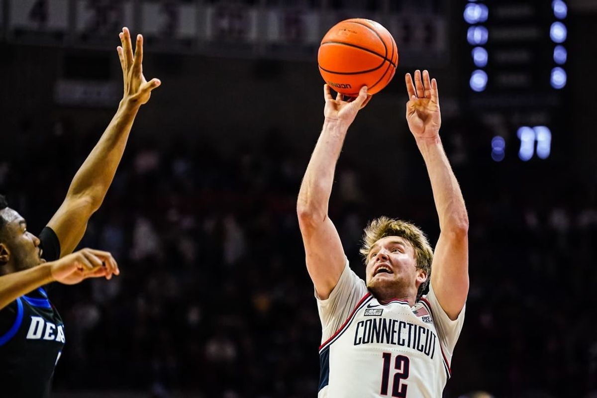 Jan 2, 2024; Storrs, Connecticut, USA; Connecticut Huskies guard Cam Spencer (12) shoot the ball against the DePaul Blue Demons in the second half at Harry A. Gampel Pavilion.